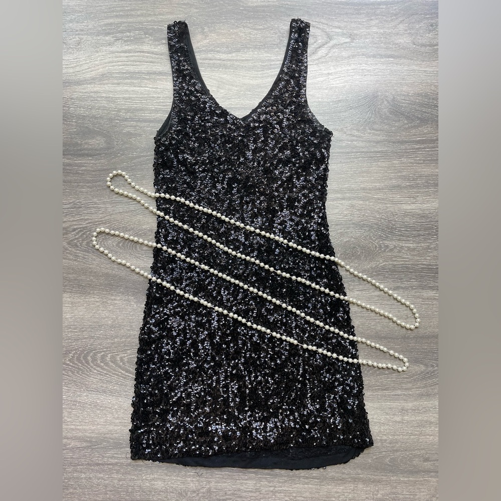 Black Sequin Sleeveless Dress with costume pearls